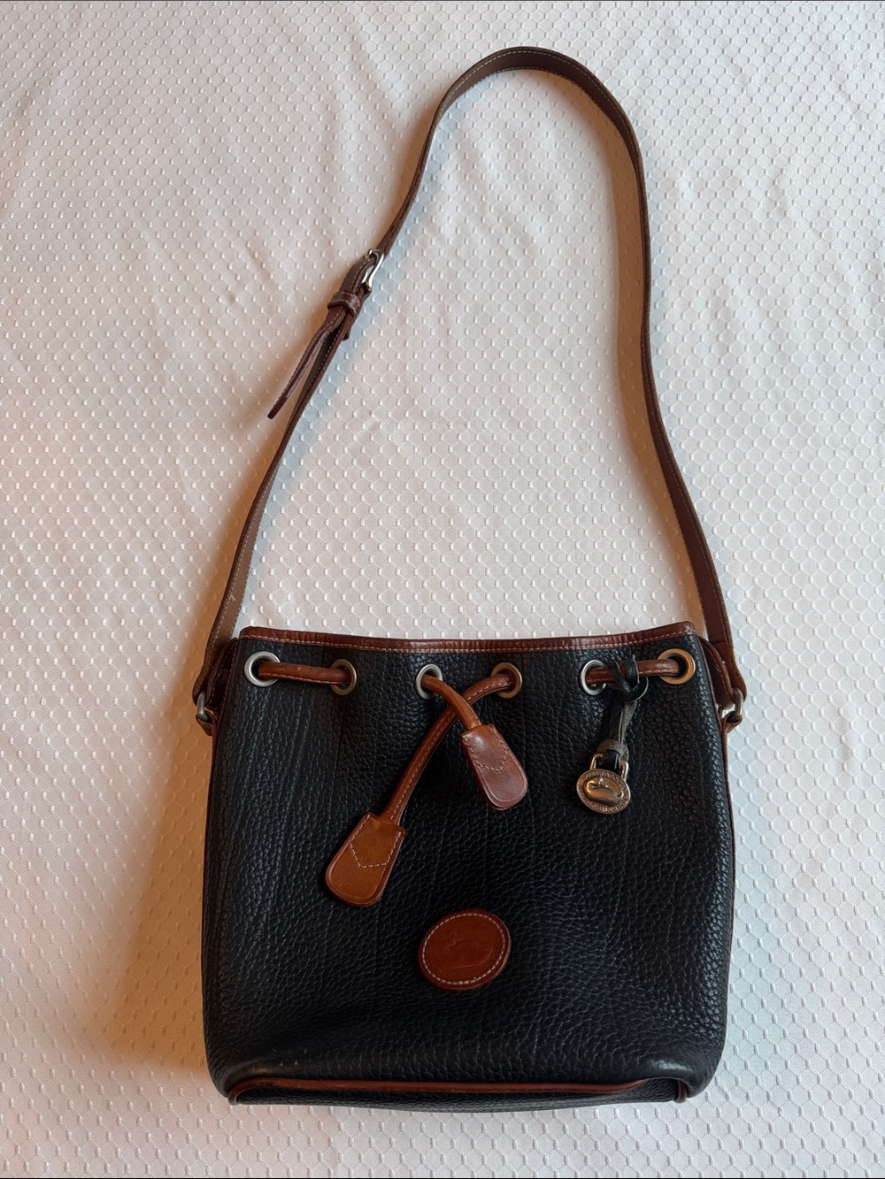 Dooney & Bourke Black Pebble Leather Shoulder Drawstring Bag with Brown Trim